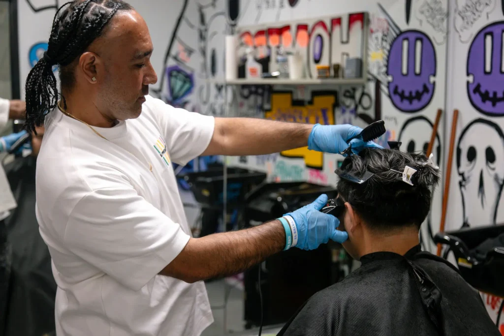 A picture of Boanergez cutting hair at Prism Fadez